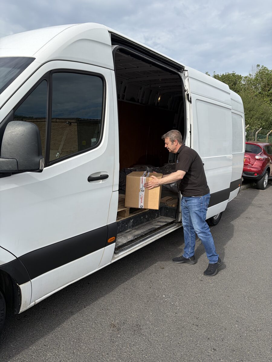 Courier loading a package for same-day delivery